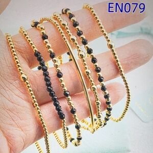 Newton Gold and Black Beaded Bracelet Collection